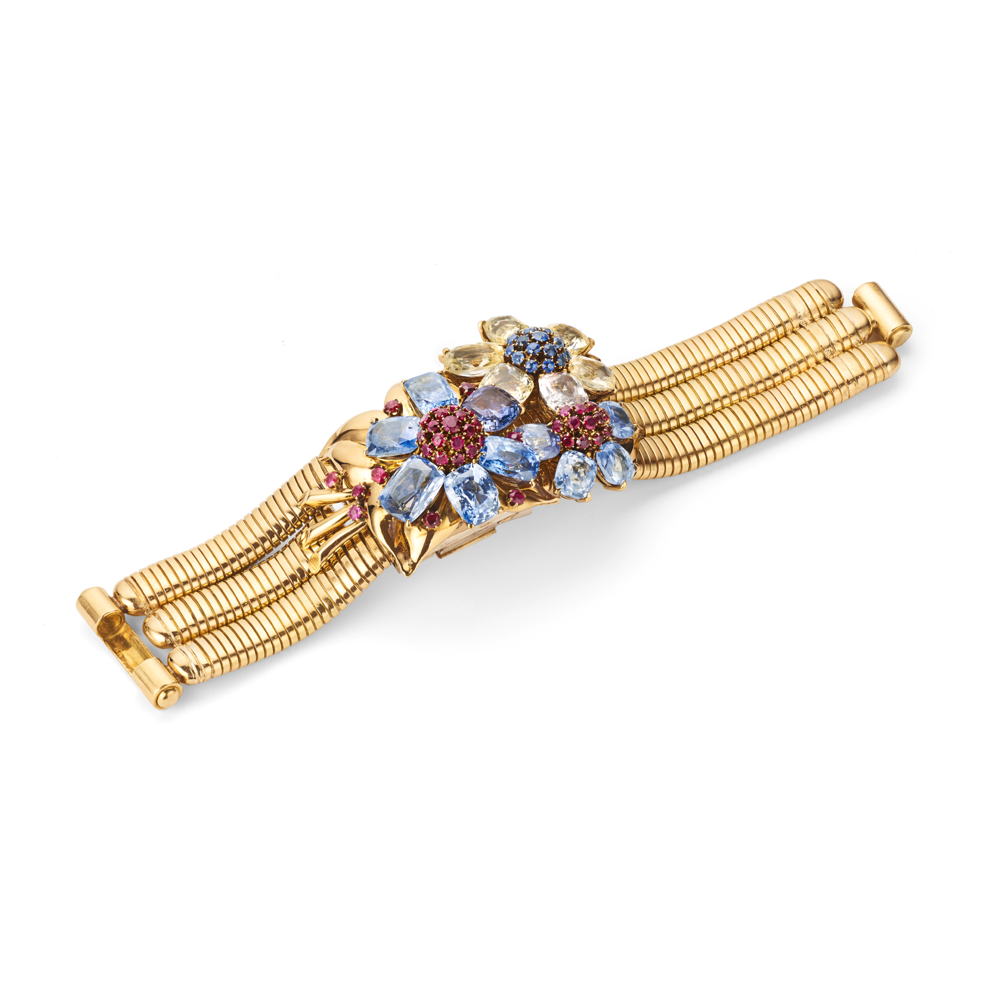 Wristwatch, 1939
Two detachable clips
Yellow gold, white gold, rubies, sapphires, and yellow sapphires
Van Cleef & Arpels Collection