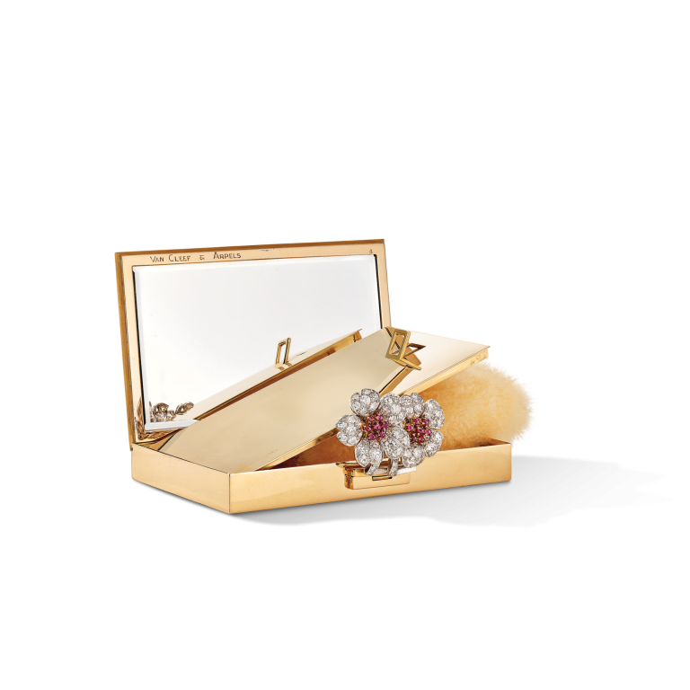 Photo of Powder compact closed by a Two Flowers clip